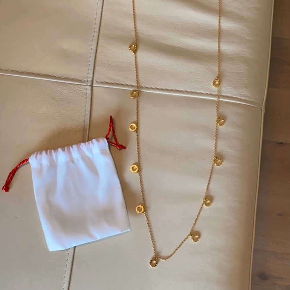 Elegant Coach gold pace stone necklace